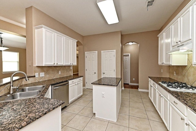 3705 Derby Trl, Round Rock, TX 78681 - kitchen featuring dishwasher, white gas stovetop, arched walkways, under cabinet range hood, and white cabinets