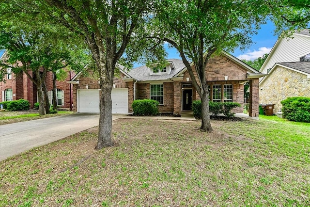 3705 Derby Trl, Round Rock, TX 78681 - view of front of property with a garage, driveway, brick siding, and a front lawn