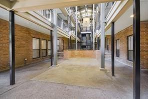 1910 Robbins Pl Unit 301, Austin, TX 78705 - view of community with a towering ceiling and brick wall