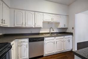 kitchen with stainless steel dishwasher, a sink, white cabinetry, and dark countertops