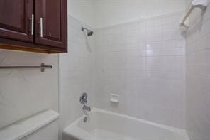 bathroom with  shower combination and toilet