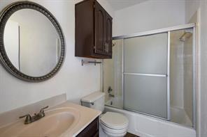 1910 Robbins Pl Unit 301, Austin, TX 78705 - full bathroom with vanity, toilet, and shower / bath combination with glass door