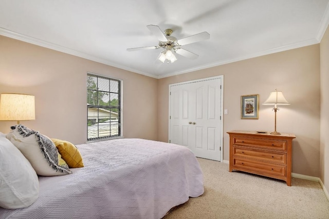 bedroom featuring crown molding, baseboards, ceiling fan, and light colored carpet