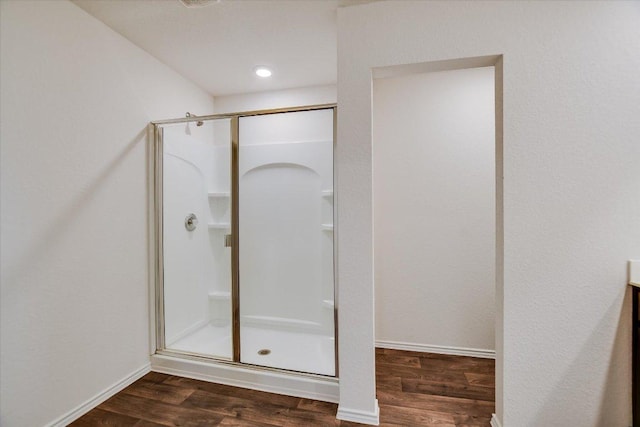 15005 Bajada Rd, Manor, TX 78653 - bathroom with a shower stall, wood finished floors, and baseboards