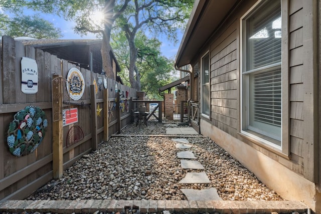 view of side of home with fence