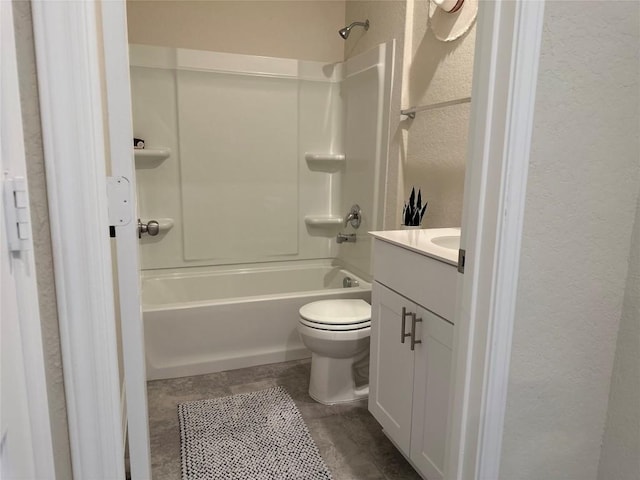 full bathroom with vanity, a textured wall, toilet, and shower / tub combination