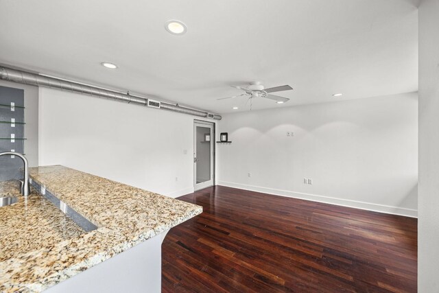 unfurnished living room featuring baseboards, recessed lighting, ceiling fan, and wood finished floors