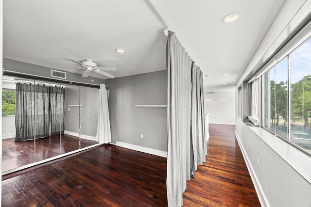 unfurnished bedroom featuring baseboards, wood-type flooring, recessed lighting, and visible vents