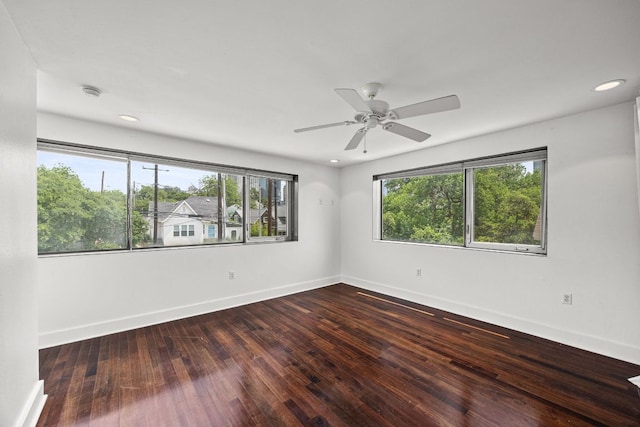 empty room featuring baseboards, a ceiling fan, recessed lighting, and hardwood / wood-style floors
