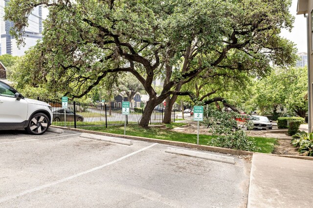 uncovered parking lot with fence