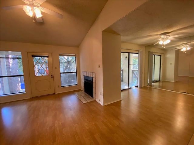 entrance foyer featuring ceiling fan, a wealth of natural light, and wood finished floors