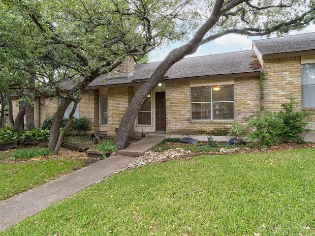 8301 Summer Side Dr Unit 167, Austin, TX 78759 - view of front of house featuring a front lawn, brick siding, and a shingled roof