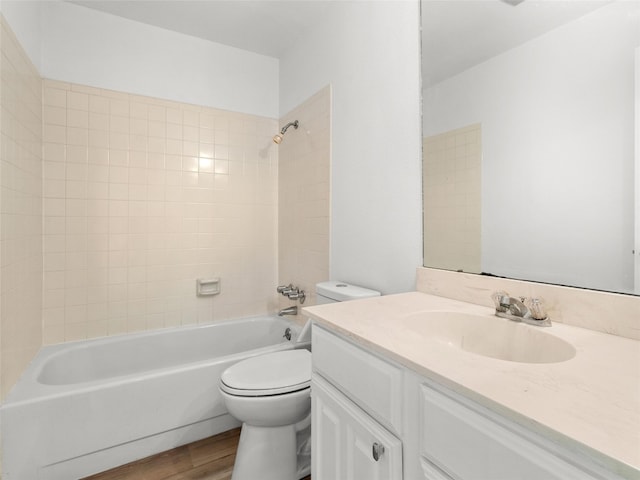 bathroom with shower / bath combination, vanity, toilet, and wood finished floors