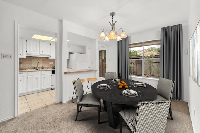 8301 Summer Side Dr Unit 167, Austin, TX 78759 - dining room featuring a chandelier, light colored carpet, and light tile patterned floors