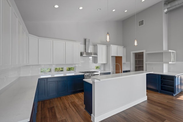 3503 Constitution Dr, Lago Vista, TX 78645 - kitchen featuring wall chimney exhaust hood, open shelves, blue cabinets, recessed lighting, and decorative backsplash