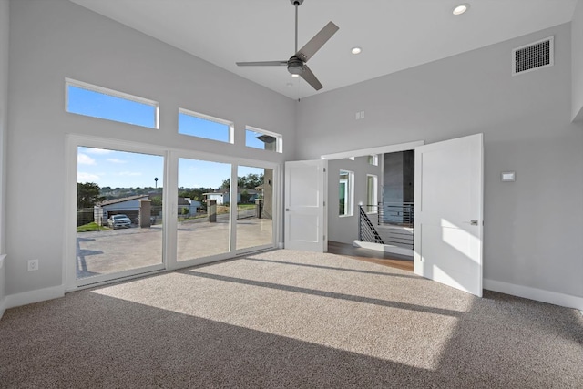 3503 Constitution Dr, Lago Vista, TX 78645 - spare room with a towering ceiling, ceiling fan, recessed lighting, and carpet floors