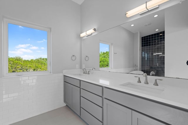 3503 Constitution Dr, Lago Vista, TX 78645 - full bath with double vanity, a tile shower, and tile patterned flooring