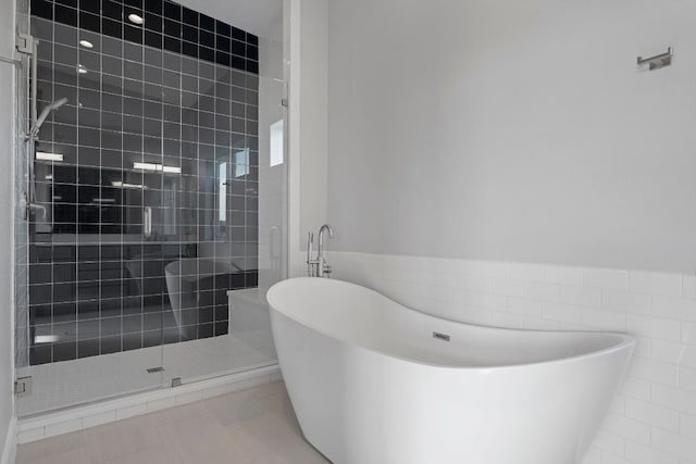 3503 Constitution Dr, Lago Vista, TX 78645 - full bathroom featuring a stall shower, a freestanding tub, and tile walls