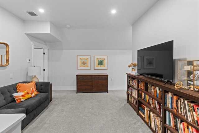 carpeted living room with recessed lighting, baseboards, and visible vents