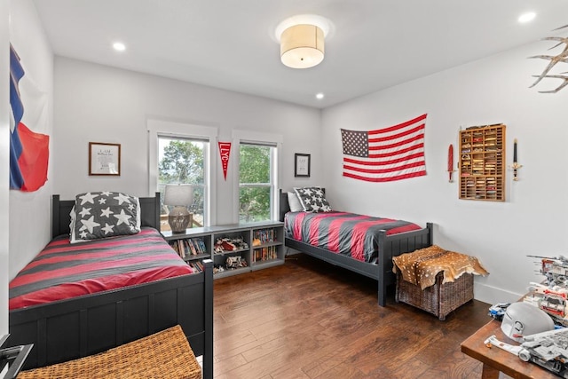 bedroom featuring recessed lighting and wood finished floors