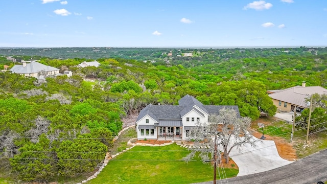 aerial view featuring a wooded view