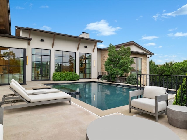 view of pool featuring a fenced in pool and a patio