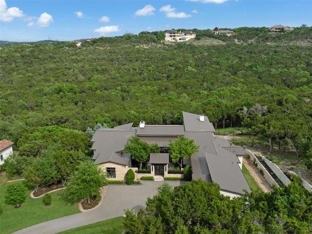birds eye view of property with a forest view