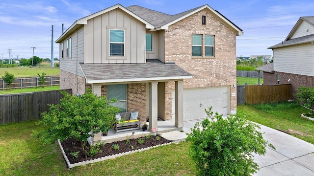 traditional home featuring a garage, a front lawn, brick siding, board and batten siding, and driveway