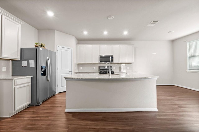 kitchen featuring decorative backsplash, dark wood-style flooring, visible vents, appliances with stainless steel finishes, and white cabinets