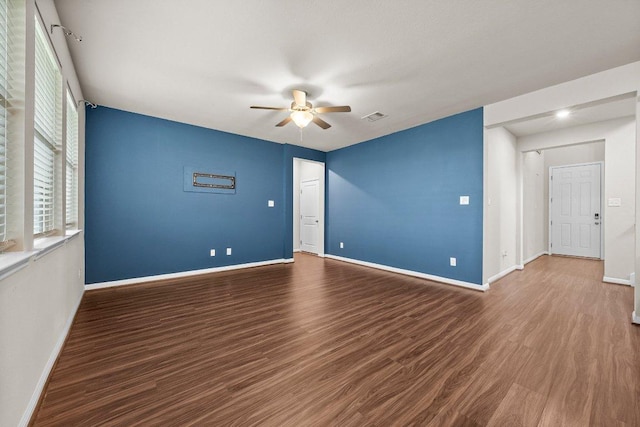 13601 Primrose Petal Dr, Manor, TX 78653 - spare room with a ceiling fan, wood finished floors, and baseboards