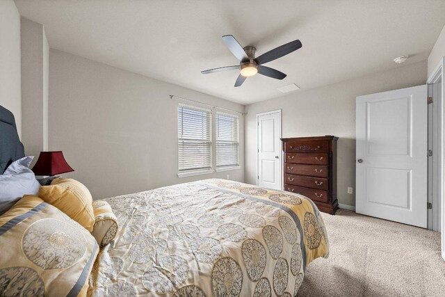 bedroom with carpet, a ceiling fan, baseboards, visible vents, and a closet