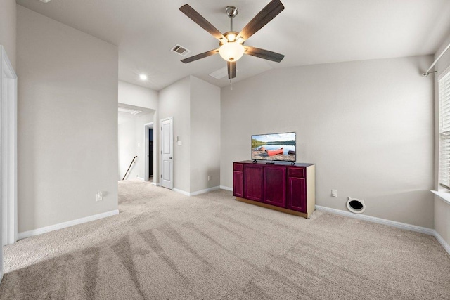 spare room featuring visible vents, baseboards, ceiling fan, and light carpet