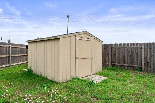 view of shed featuring a fenced backyard