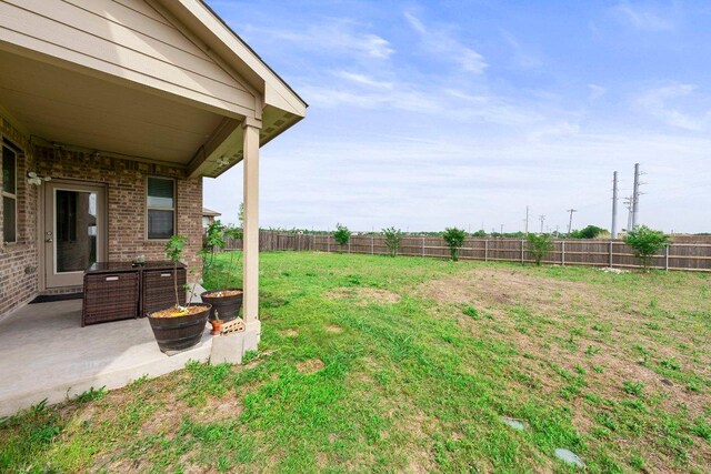 view of yard with a fenced backyard and a patio area