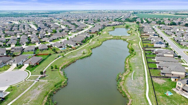 birds eye view of property featuring a water view and a residential view
