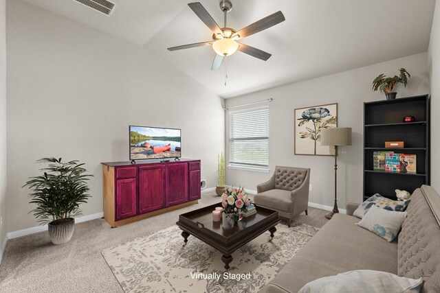 living room with visible vents, baseboards, ceiling fan, carpet, and vaulted ceiling