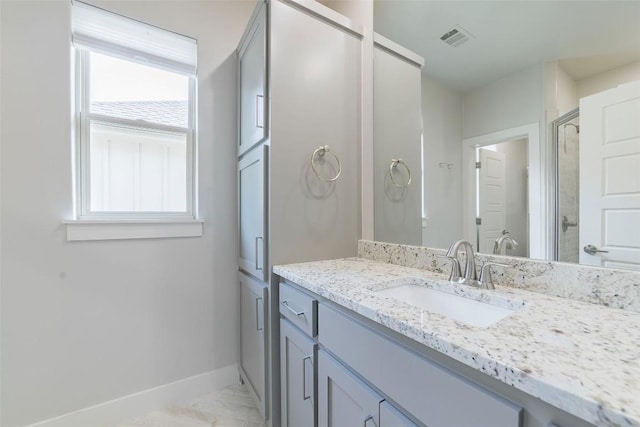 2228 Williams Lakeshore Dr, Kingsland, TX 78639 - bathroom featuring visible vents, an enclosed shower, baseboards, vanity, and marble finish floor