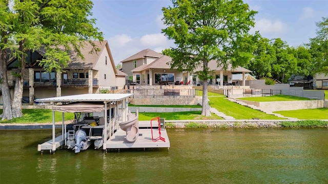 2228 Williams Lakeshore Dr, Kingsland, TX 78639 - dock area featuring a lawn, a water view, fence, and boat lift