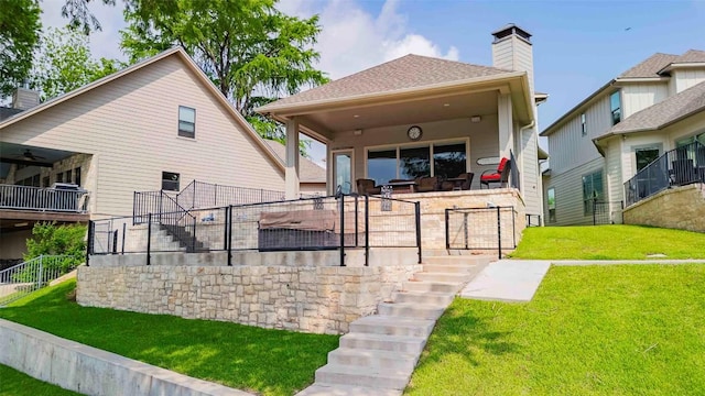 2228 Williams Lakeshore Dr, Kingsland, TX 78639 - rear view of house with fence, stairs, a chimney, and a yard