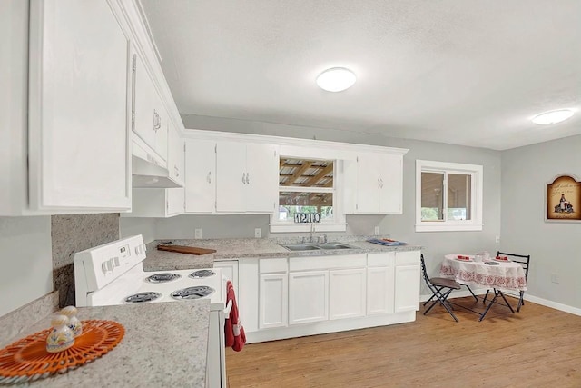 kitchen with white cabinets, white electric range oven, a sink, light wood-style flooring, and under cabinet range hood