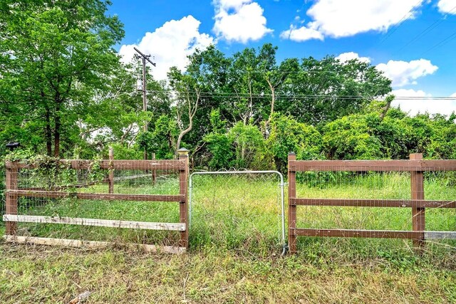 view of gate with fence