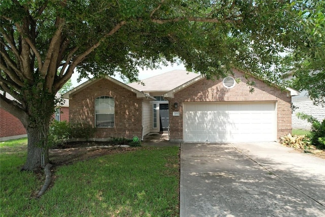 ranch-style house with brick siding, an attached garage, driveway, and a front yard
