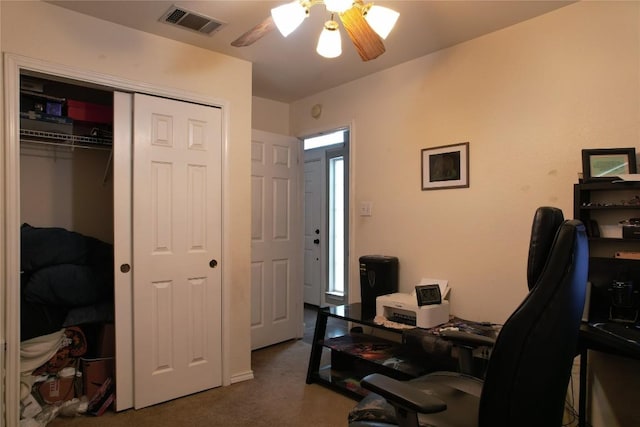 office with carpet floors, ceiling fan, and visible vents