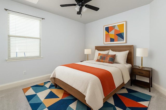 bedroom with baseboards, ceiling fan, and carpet