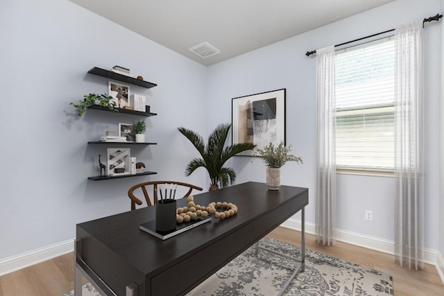 2509 Lightfoot Trl, Austin, TX 78745 - home office with baseboards and light wood-style flooring