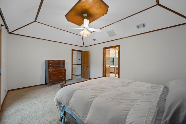 carpeted bedroom featuring baseboards, visible vents, and vaulted ceiling