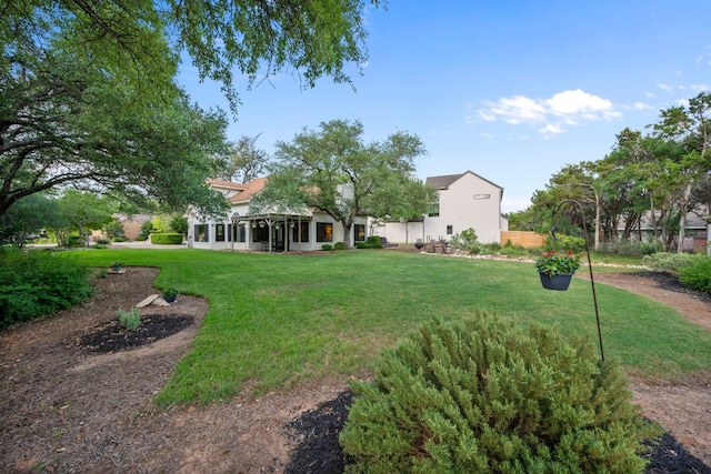 view of yard with a sunroom