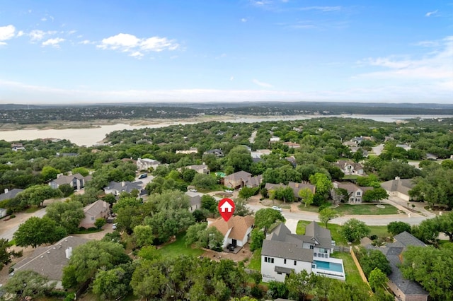 drone / aerial view with a residential view and a water view