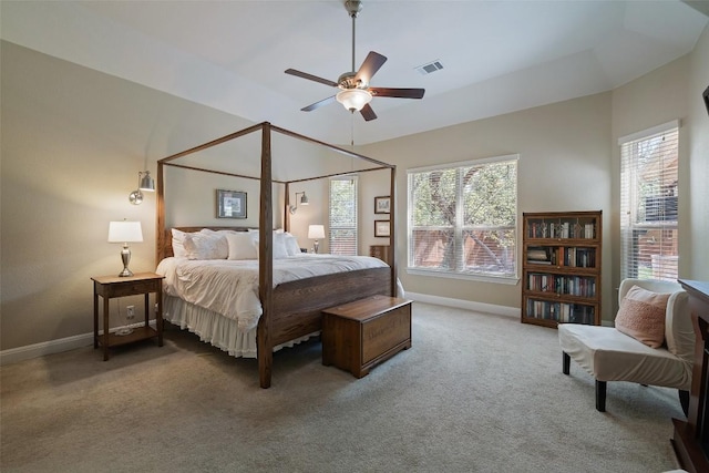 bedroom with a ceiling fan, baseboards, visible vents, and carpet