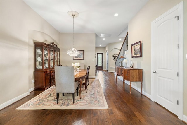 dining room featuring visible vents, baseboards, a notable chandelier, recessed lighting, and dark wood-type flooring